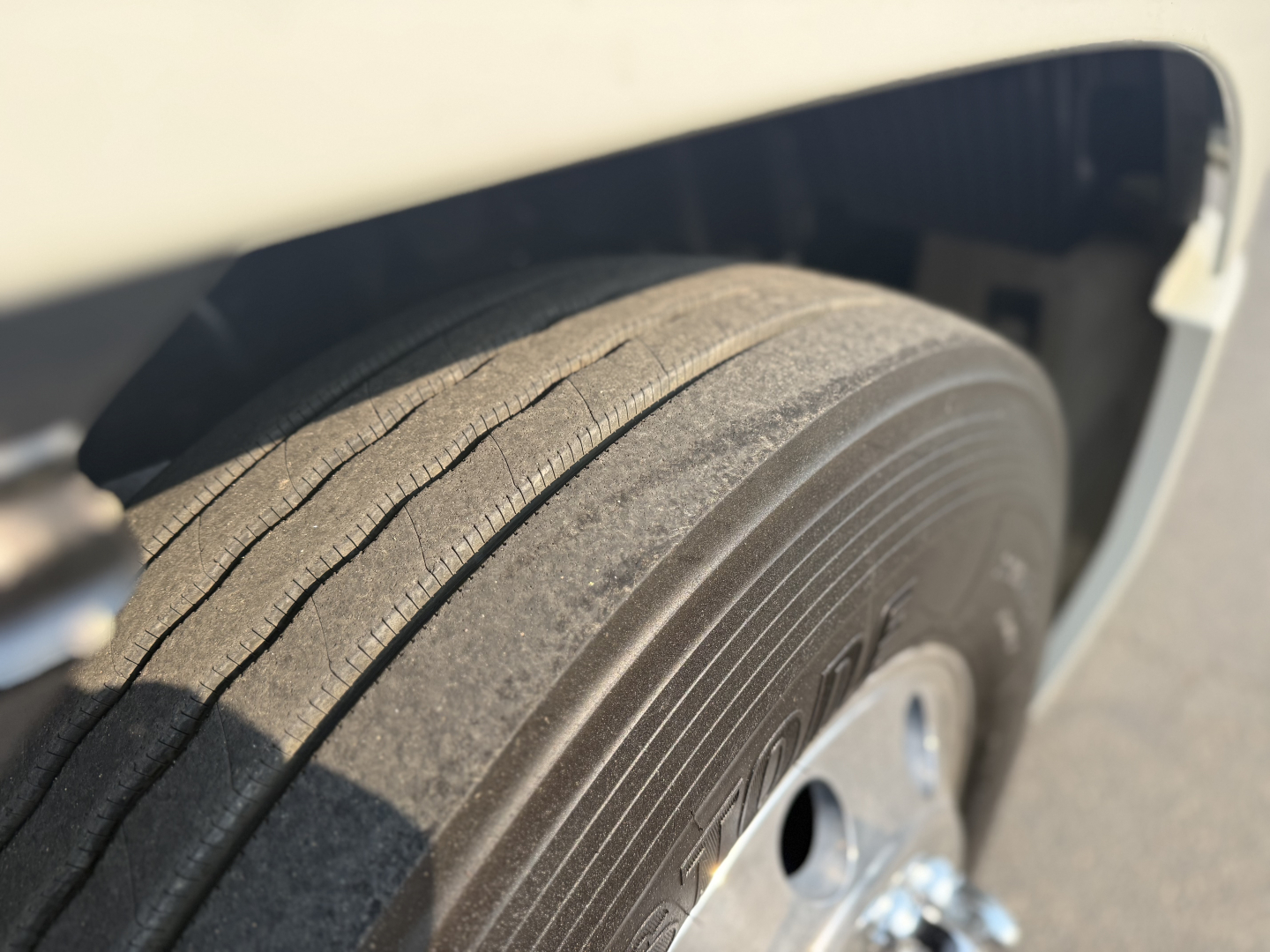 Mack Anthem 2020 front wheel and fender showing tire tread and wheel well.
