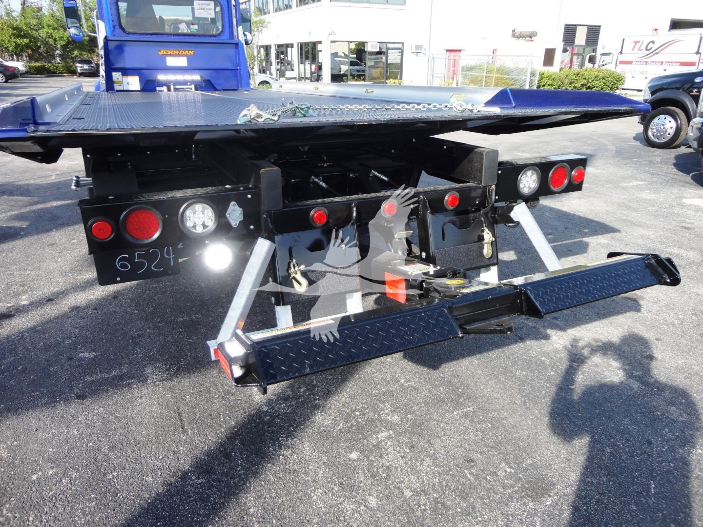 Peterbilt 337 rollback bed rear view showing hydraulic ramps and taillights