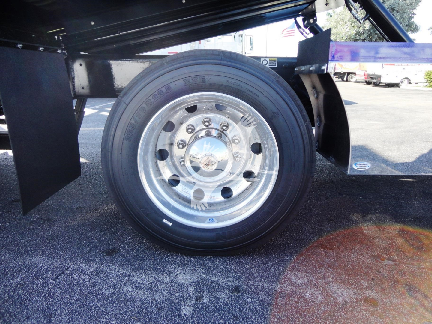 Peterbilt 337 truck wheel and rear axle shown in rollback layout with polished steel rim and tire.
