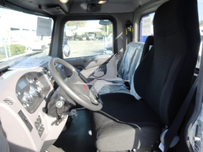 Peterbilt 337 interior with steering wheel and driver seat, dashboard gauges visible.