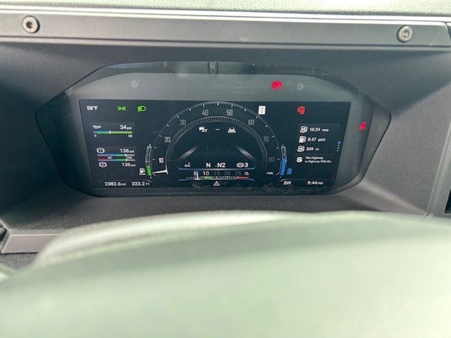 Dashboard display from a 2027 Mack AN64T showing digital gauge cluster with speedometer, various indicators, and trip info.