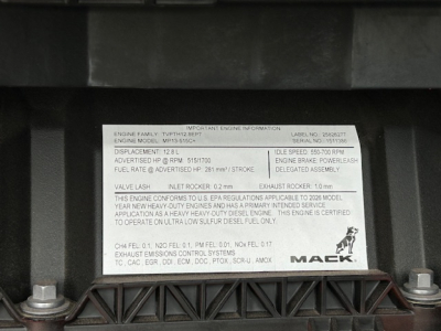 Mack engine information placard showing engine family, model MP13-515, serial number 101131, with warnings and horsepower details.