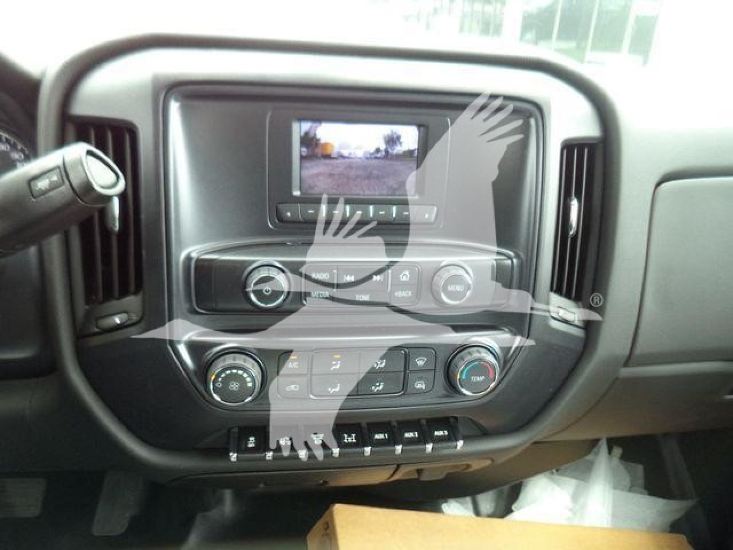 Chevrolet Silverado 6500HD dashboard and center console with infotainment screen and control buttons.