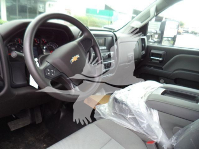 Chevrolet Silverado 6500HD interior showing steering wheel with bowtie logo and front console.