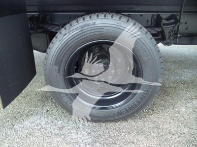 Chevrolet Silverado 6500HD truck wheel and tire view showing tire sidewall and hub area