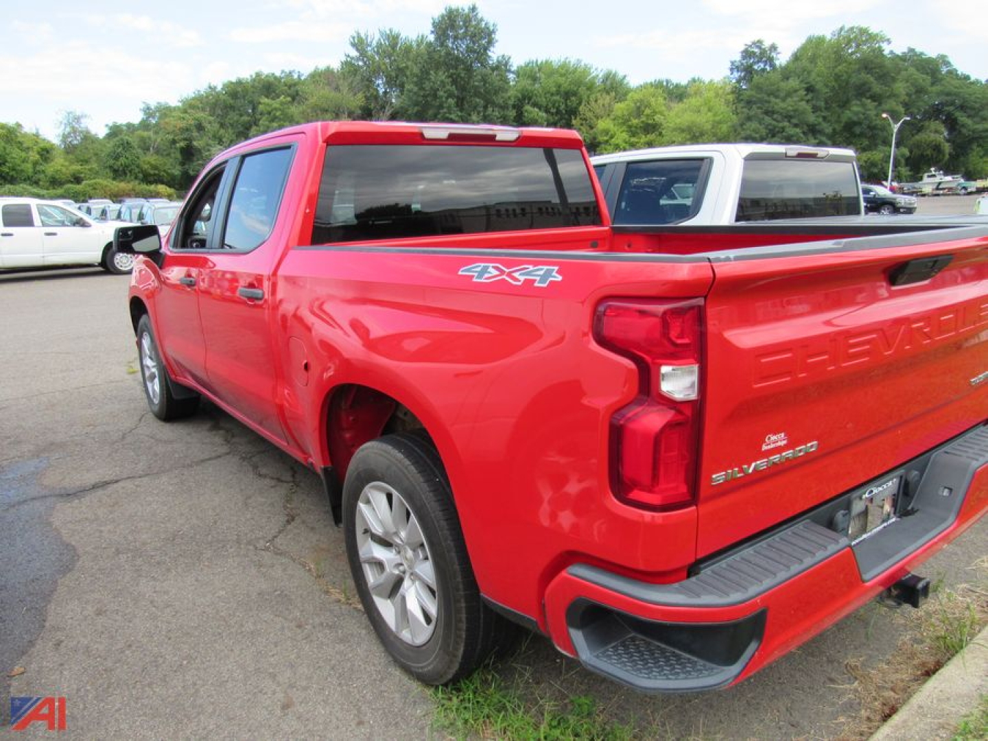 Chevrolet Silverado 1500 Limited pickup truck rear-right view showing 4x4 badge and red body