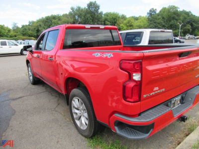 Chevrolet Silverado 1500 Limited pickup truck rear-right view showing 4x4 badge and red body