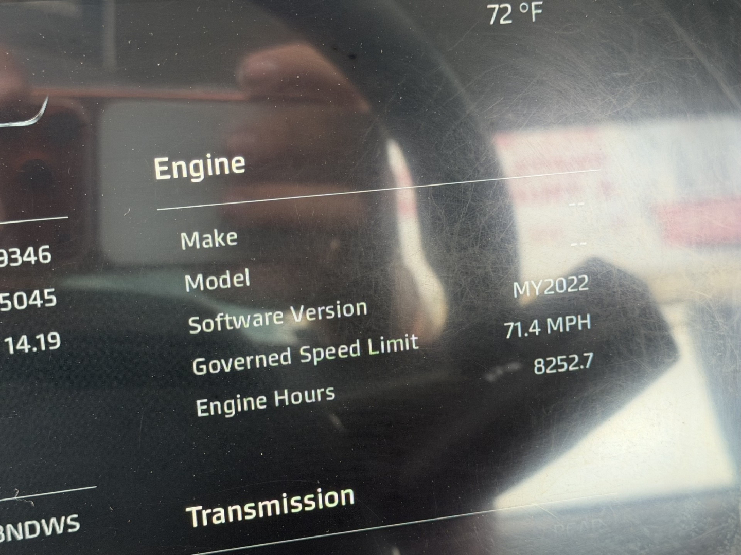 Vehicle dashboard screen showing Engine section with text: Engine Make Model Software Version MY2022 Transmission etc. Numeric values 71.4 MPH, 82527 hours
