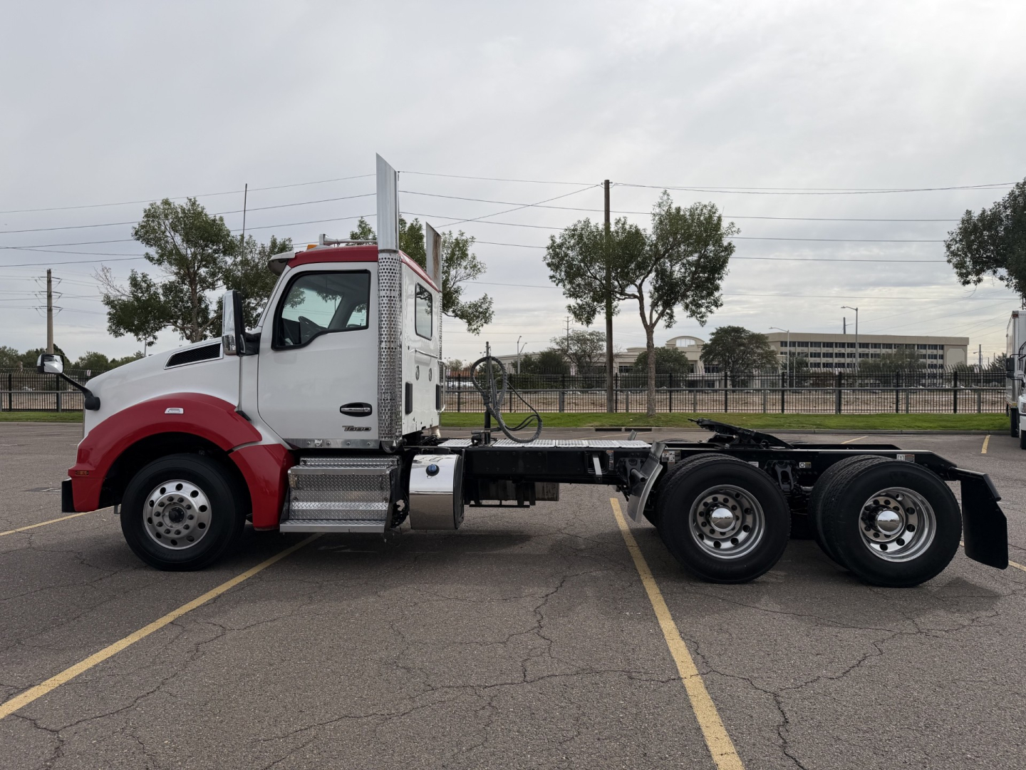 Kenworth T880 truck chassis side view showing cab and rear dual-axle wheels.