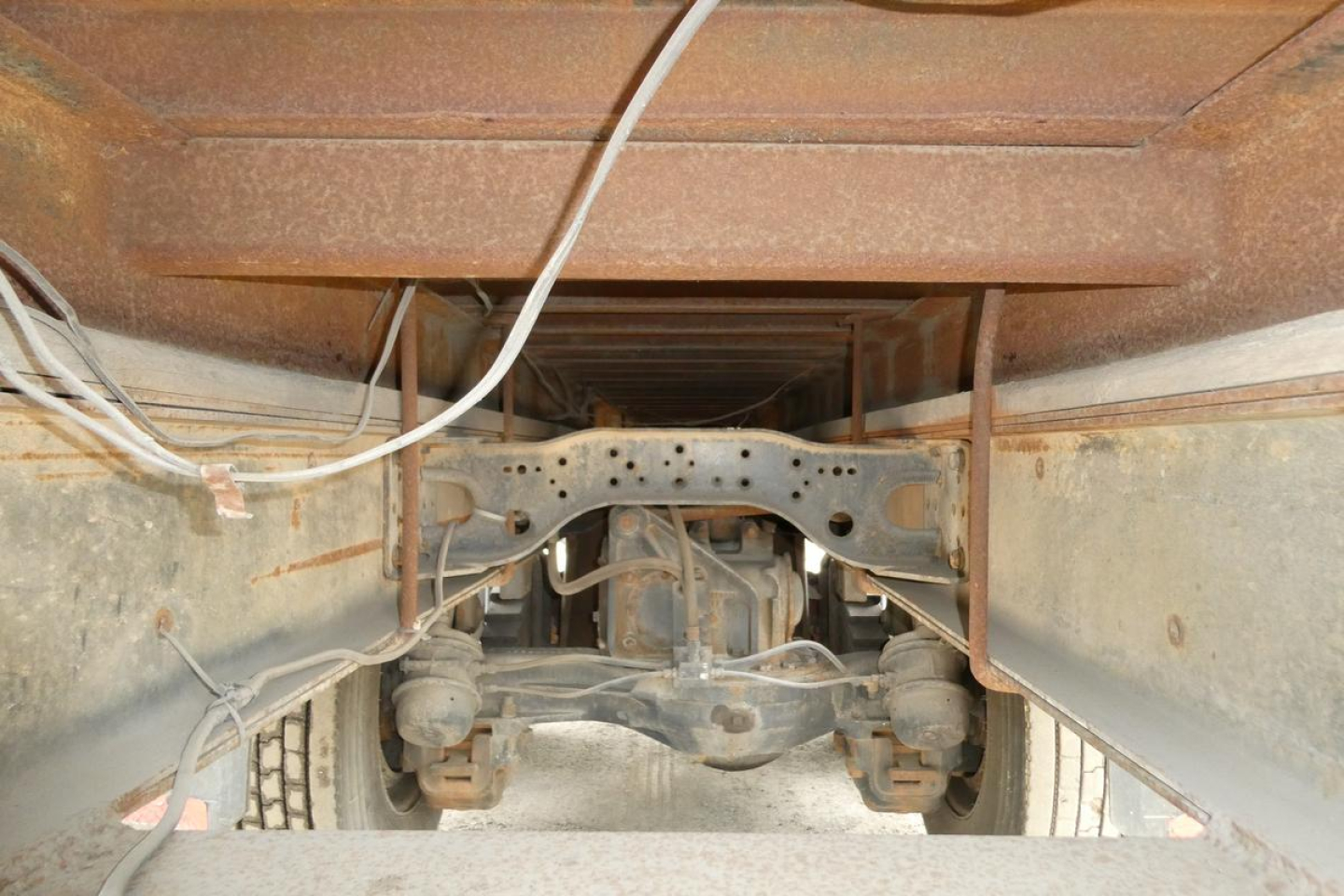 Mack RD690S chassis underside view showing rear axle, suspension, and frame rails.