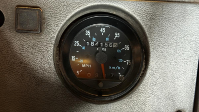 Mack RD690S dashboard speedometer showing MPH and km/h gauges in instrument cluster.