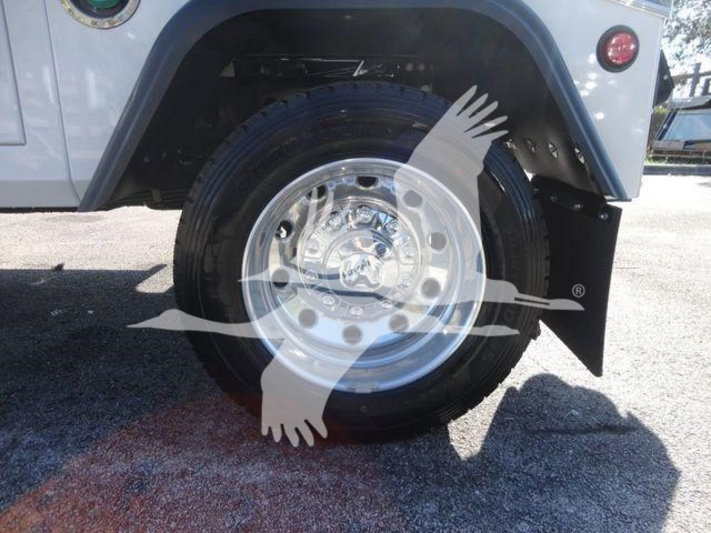 Wheel well and tire of a 2024 Ram 4500 SLT with a polished steel wheel and black fender; no legible text visible on components.