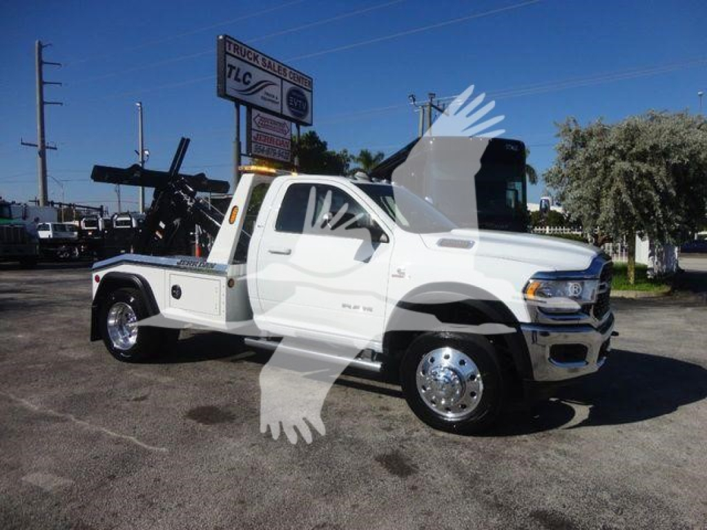 2024 Ram 4500 SLT tow truck in service bay showing front and side view with equipment bed and winch mount.