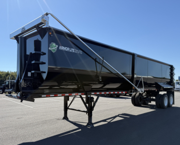 Armor Lite dump trailer in serviceable condition showing 40' x 78" dimensions with black metal body and dual rear axles, front nose cone, and landing jack.