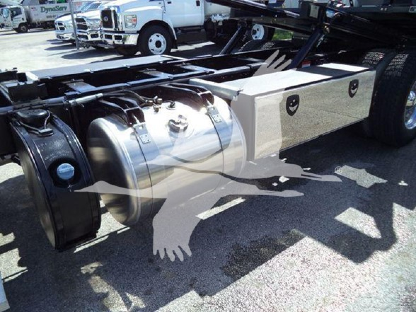 Peterbilt 337 rollback truck chassis showing fuel tank and toolbox with side view of driveline and frame.