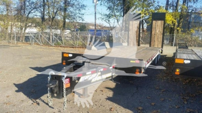 Trailer hitch and flatbed trailer showing gooseneck receiver and chains; Steel deck with side rails and amber lights.