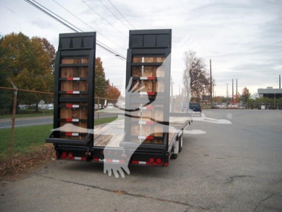 Flatbed trailer rear view showing two ramp doors and taillights, with branding watermark across image.