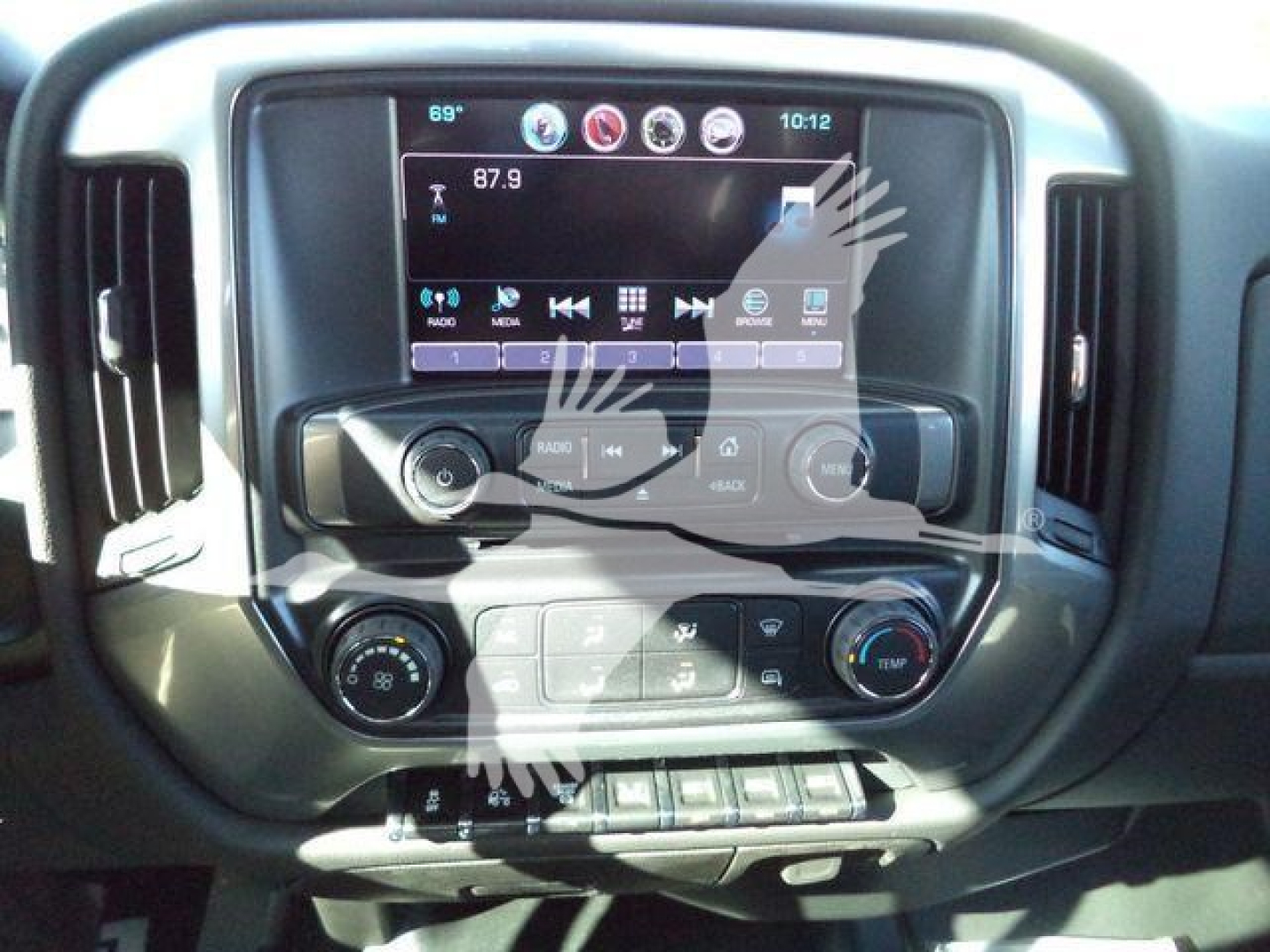Dashboard of a 2023 Chevrolet Silverado 6500HD showing touchscreen infotainment system and control knobs.