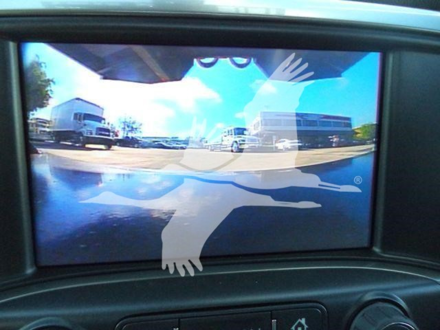 New 2023 Chevrolet Silverado 6500HD with stock number 21YRDGRAPCHEV showing a rear window display with dealership reflections.