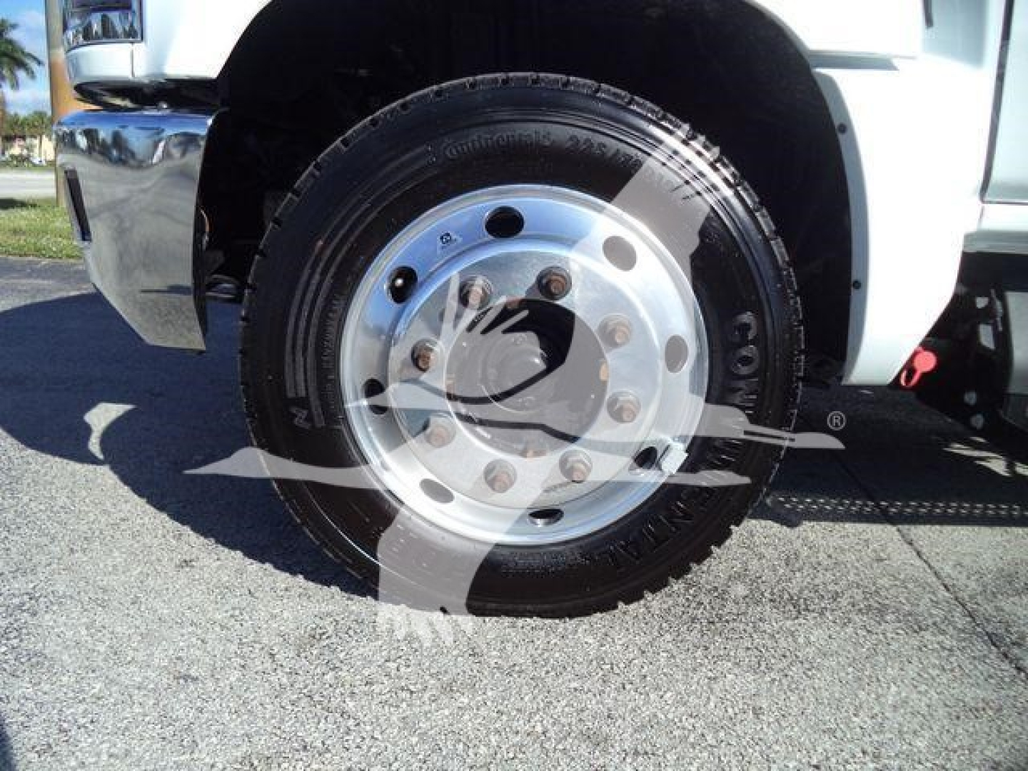 Truck wheel and chrome hub showing tire and wheel well of a 2023 Chevrolet Silverado 6500HD.
