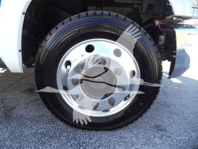 Chevrolet Silverado 6500HD wheel and tire along with hubcap and front fender visible.