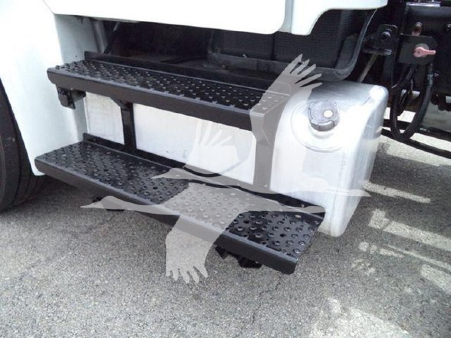 Truck side step/footboard view on Freightliner M2 106 with textured steps.