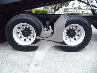 Freightliner Business Class M2 106 rear dual wheels showing twin tires and suspension undercarriage.