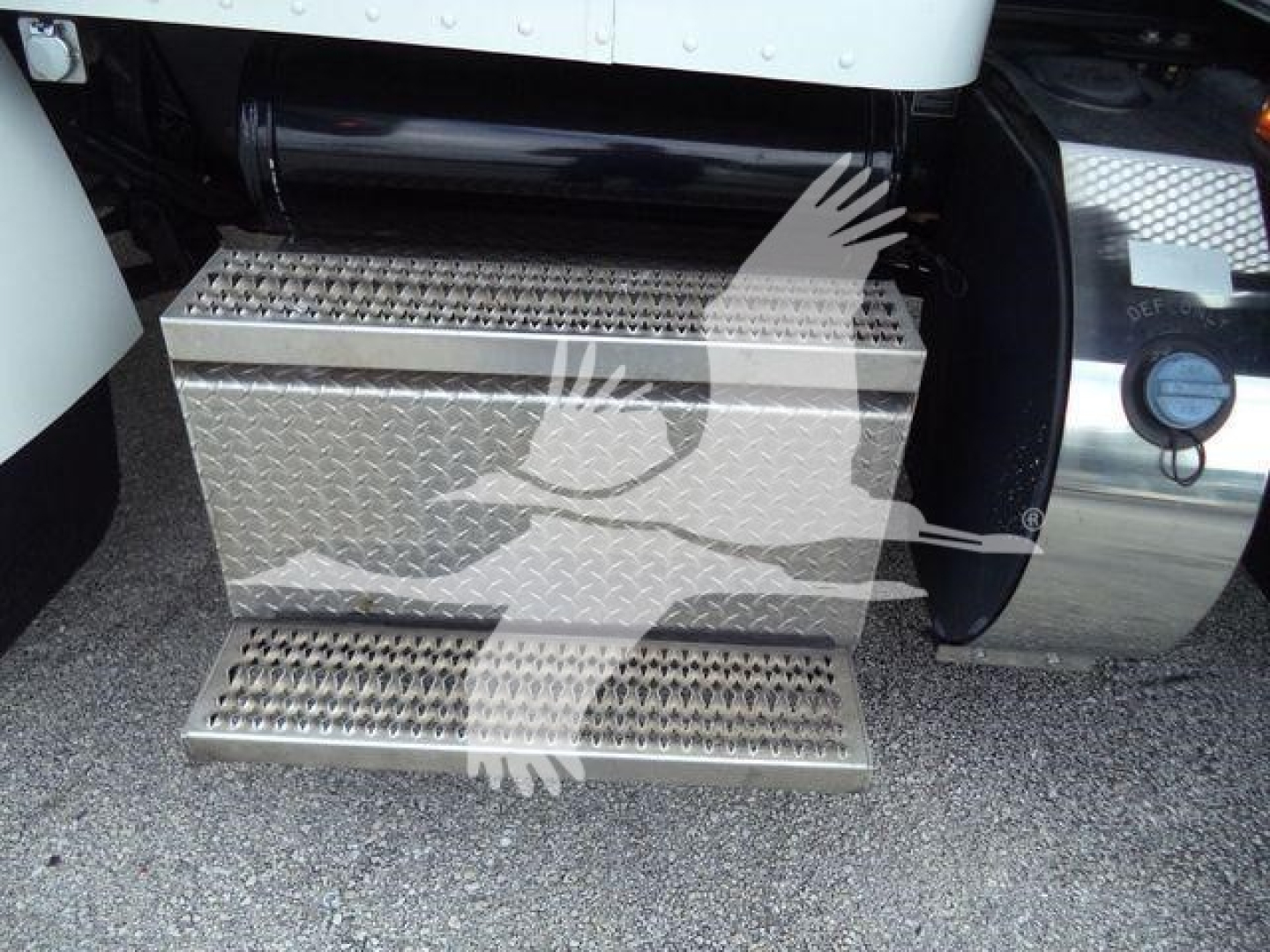 Peterbilt 337 side view showing diamond-plate steel toolbox and steps under cab access.