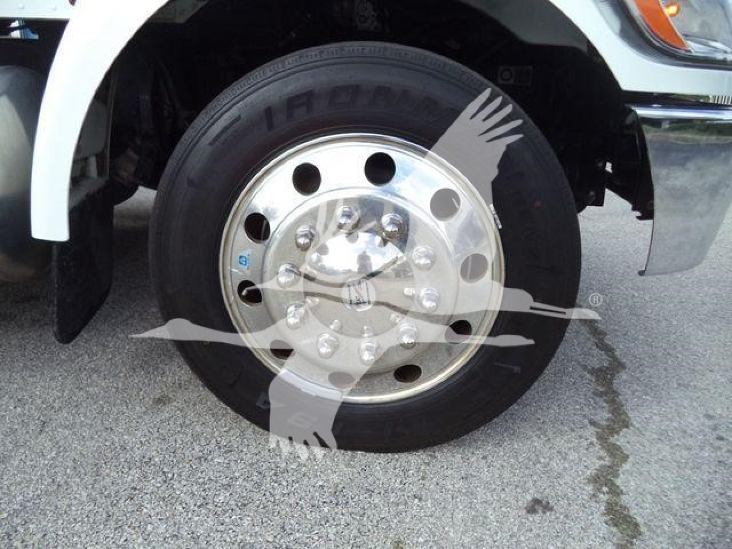 Peterbilt 337 front wheel showing steel dual rear hub with lug nuts and tire