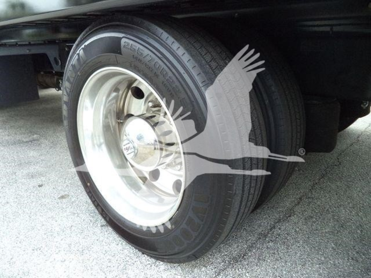 Peterbilt 337 rollback truck wheel close-up showing tire and rim with Cleartex lettering and hubcap.