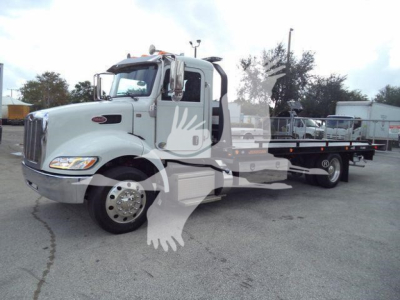Peterbilt 337 rollback truck profile with white cab and flatbed, stock number T99359FM visible in listing photo.