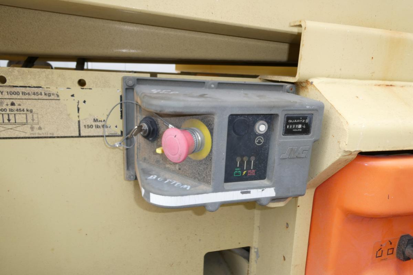 Control panel and emergency stop switch on JLG 2646ES scissor lift