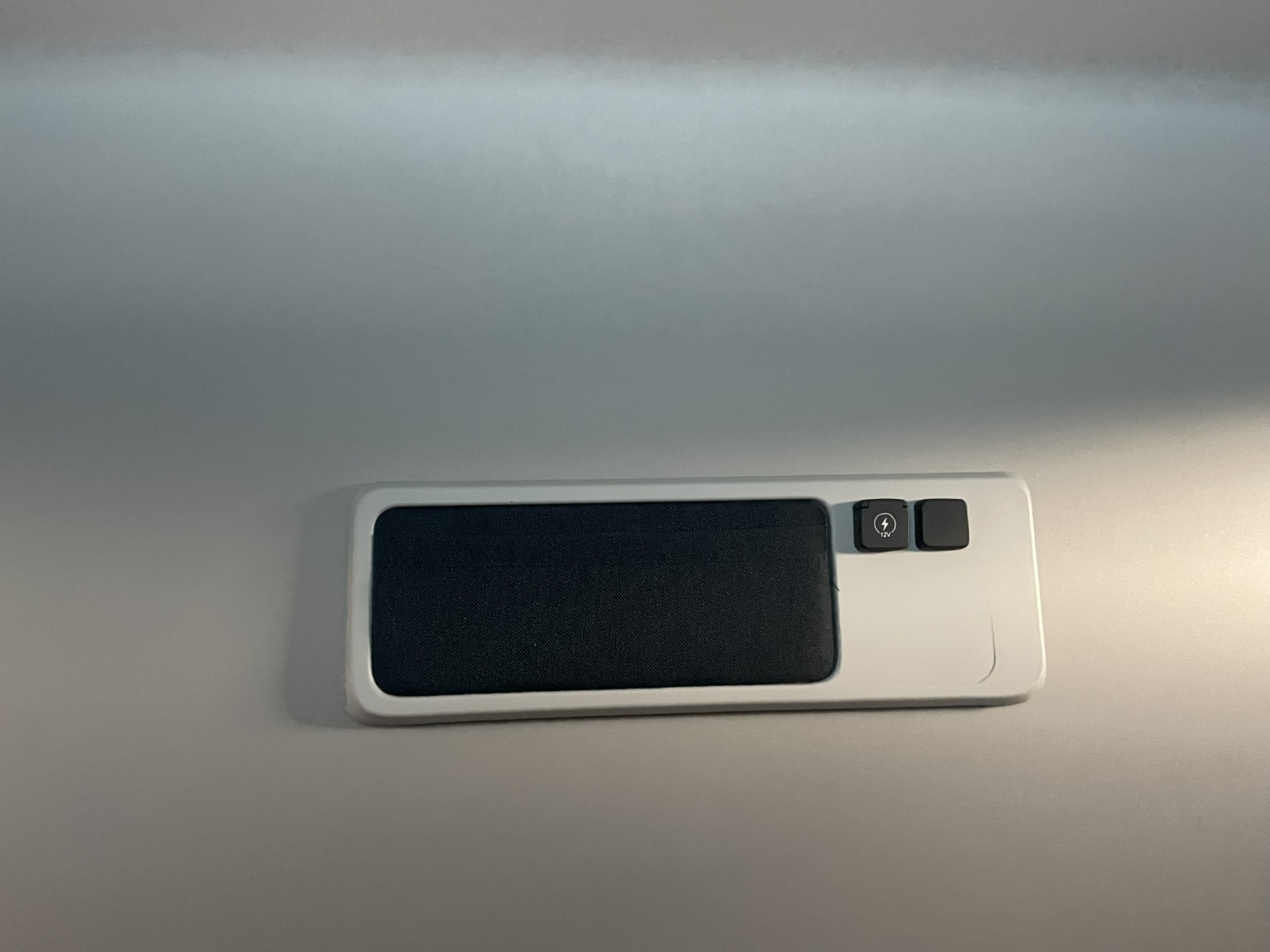 Volvo VNL64T860 interior overhead console with sunshade and small control buttons.