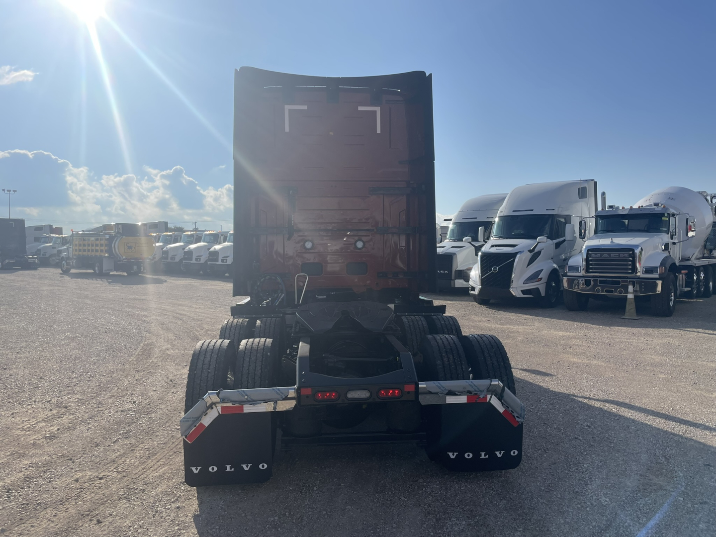 Volvo VNL64T860 truck rear view showing fifth wheel area and dual rear axles.