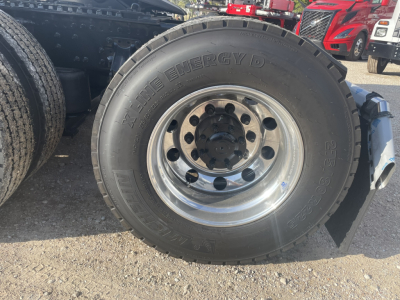 Volvo VNL64T860 truck wheel with tire and chrome rim showing MaxxPower Energy D tire branding.