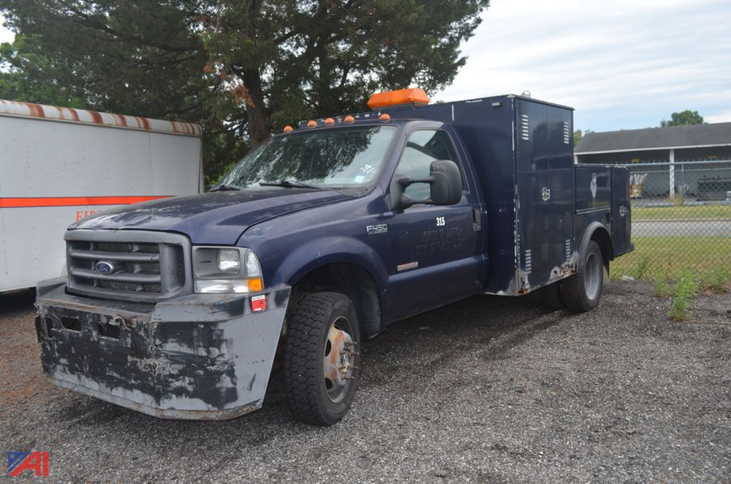 Ford F-450 Super Duty utility truck with service body, front bumper and side panels visible