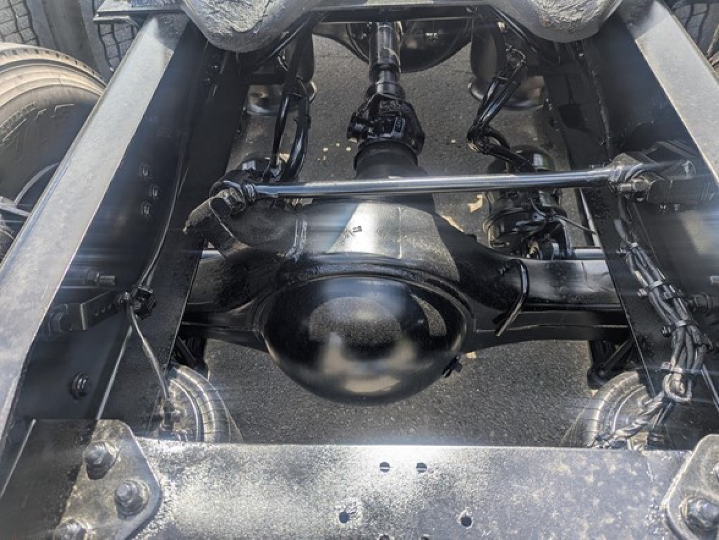 Rear view of Freightliner Cascadia 126 chassis showing differential housing and suspension components.