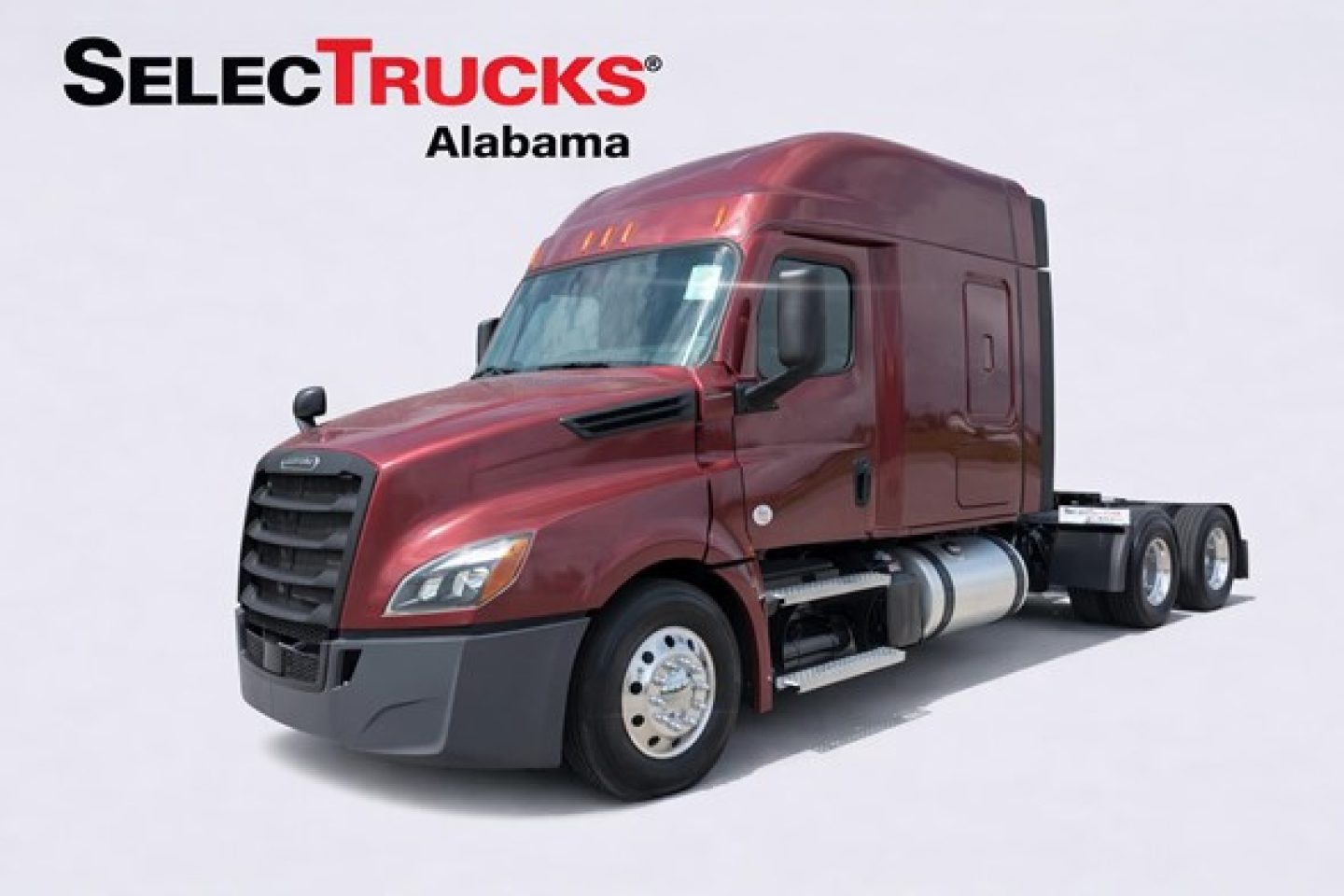 Tractor truck side view showing Freightliner Cascadia 126, maroon cab, sleepercab, two rear axles, with SelectTrucks Alabama logo.