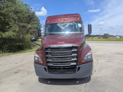 Front view of a red 2022 Freightliner Cascadia 126 truck showing grille, headlights, and bumper.