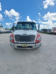 Front view of 2018 Freightliner M2 tow truck showing grille, headlights, and chrome bumper with New York plates.