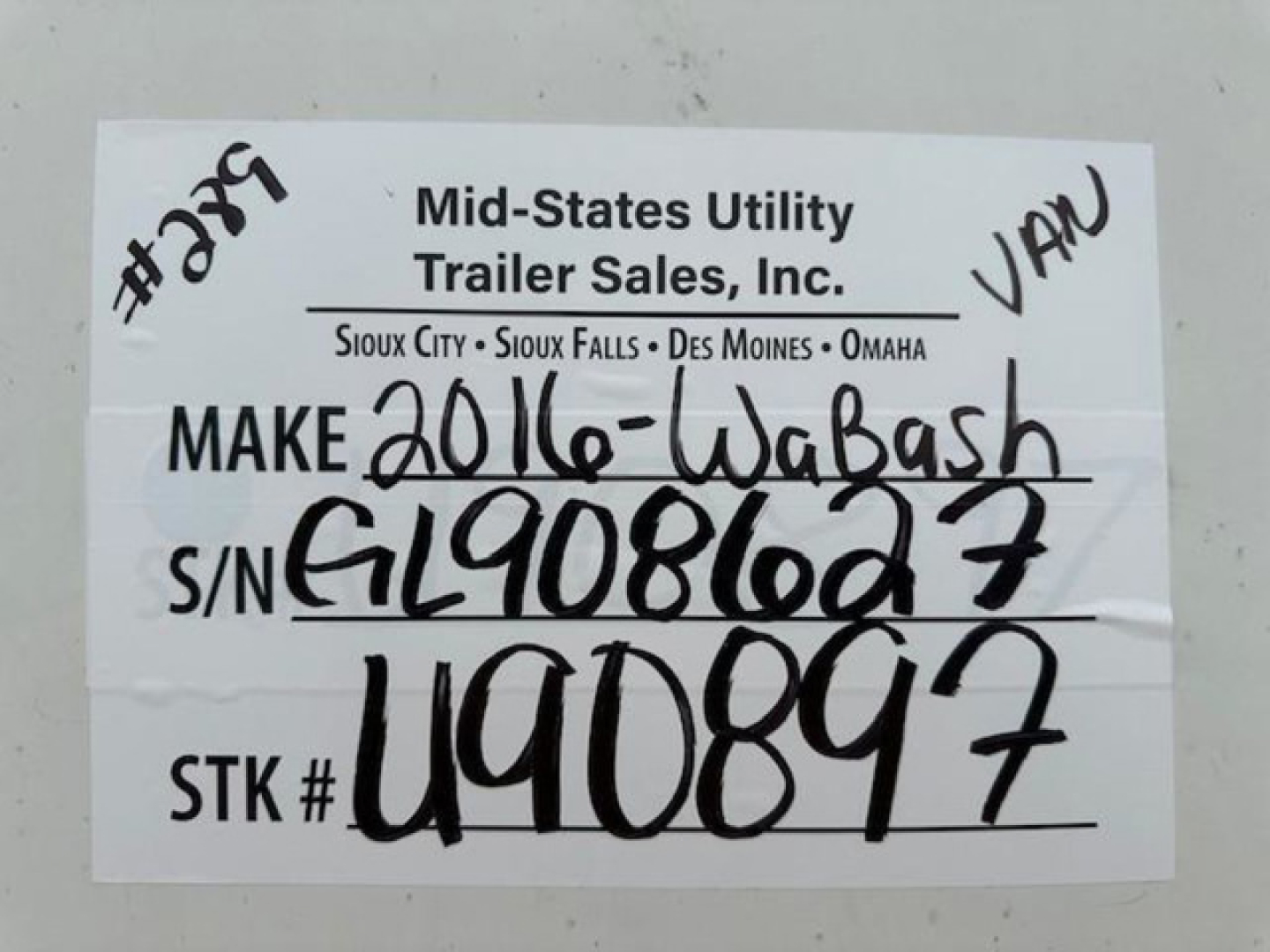 Label reading Mid-Sates Utility Trailer Sales, Inc. Make 2016-Wabash S/N G190861g7 STK # U90897 handwritten.