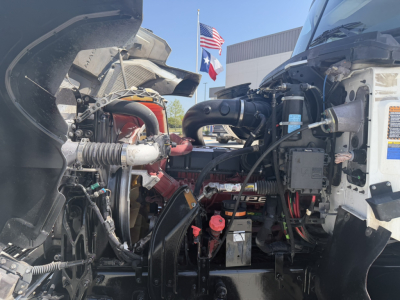 2020 Mack PI64T left and right engine bay view showing dash-to-engine components and hoses.