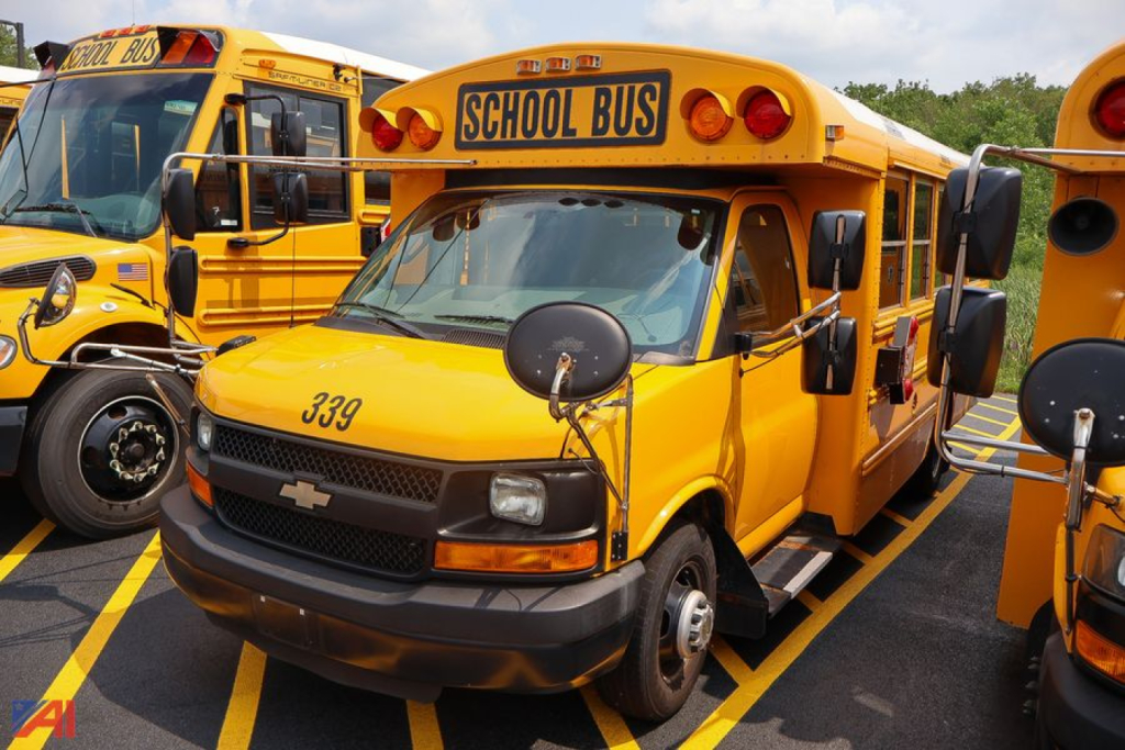 2016 Chevrolet Thomas Express mid-size school bus labeled 339 with SCHOOL BUS sign on the front, parked among other yellow buses.