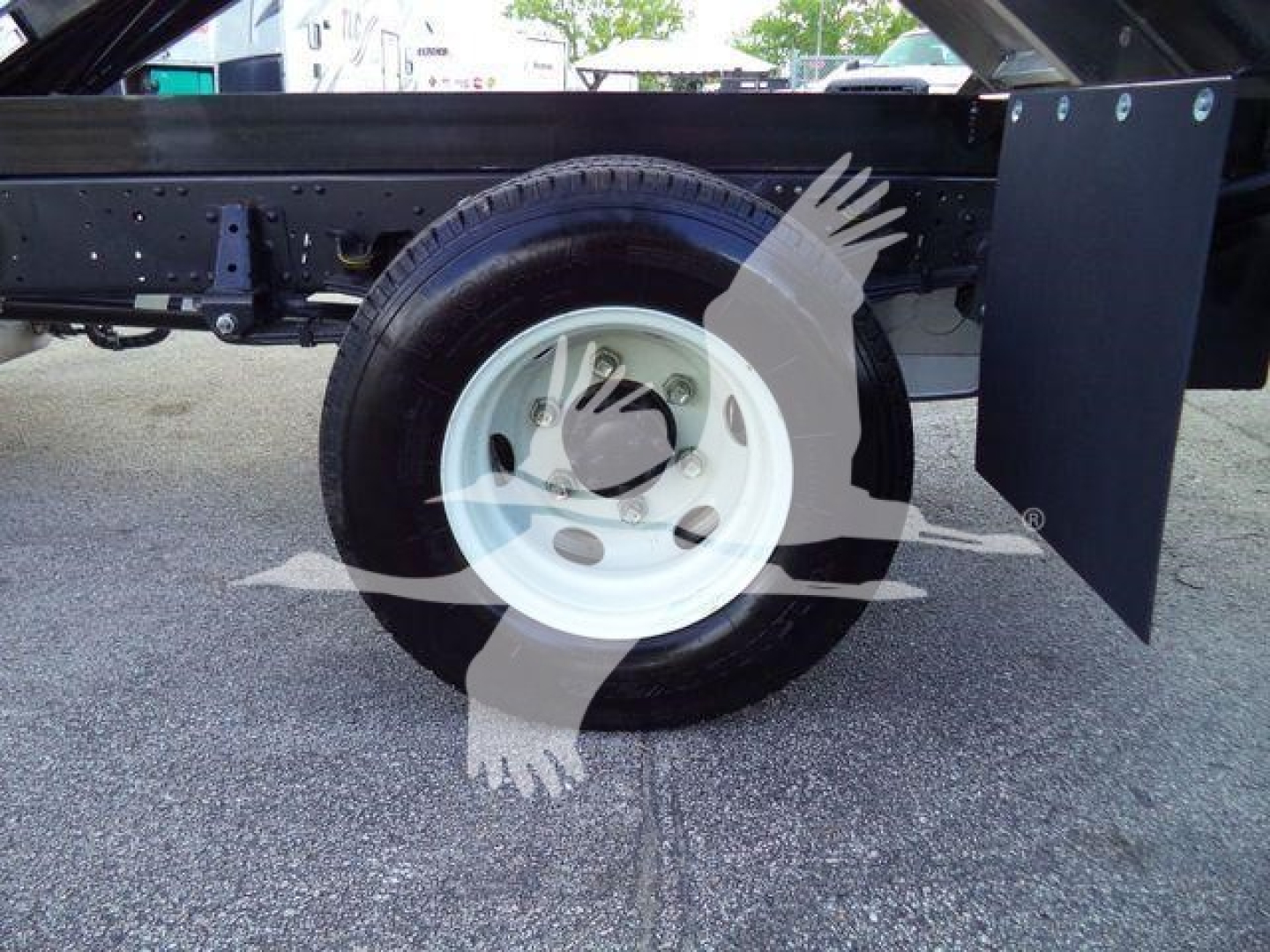 Heavy-duty Isuzu NPR HD dump truck chassis with wheel and fender visible
