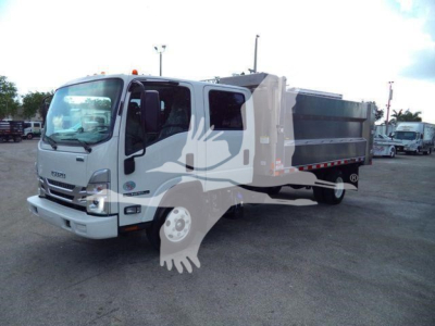Isuzu NPR HD dump truck in a lot, cab front view with dump bed and side lettering not visible.