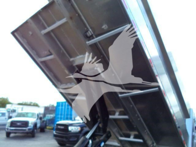 Isuzu NPR HD dump truck bed raised showing steel frame and hydraulic mechanism.