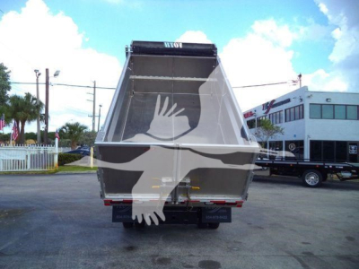 Rear view of a 2023 Isuzu NPR HD dump truck with its bed raised, showcasing the dump area and tailgate.