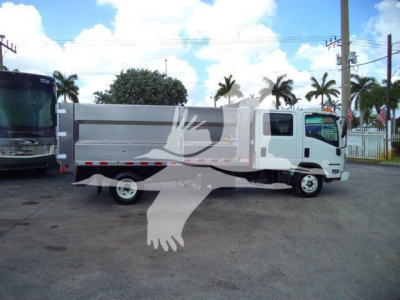 Isuzu NPR HD dump truck side view showing cargo bed and cab with white body.
