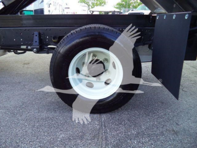 Heavy-duty Isuzu NPR HD dump truck chassis with wheel and fender visible