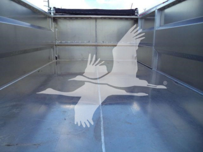 Isuzu NPR-HD dump truck bed interior view showing metallic cargo bed walls and floor